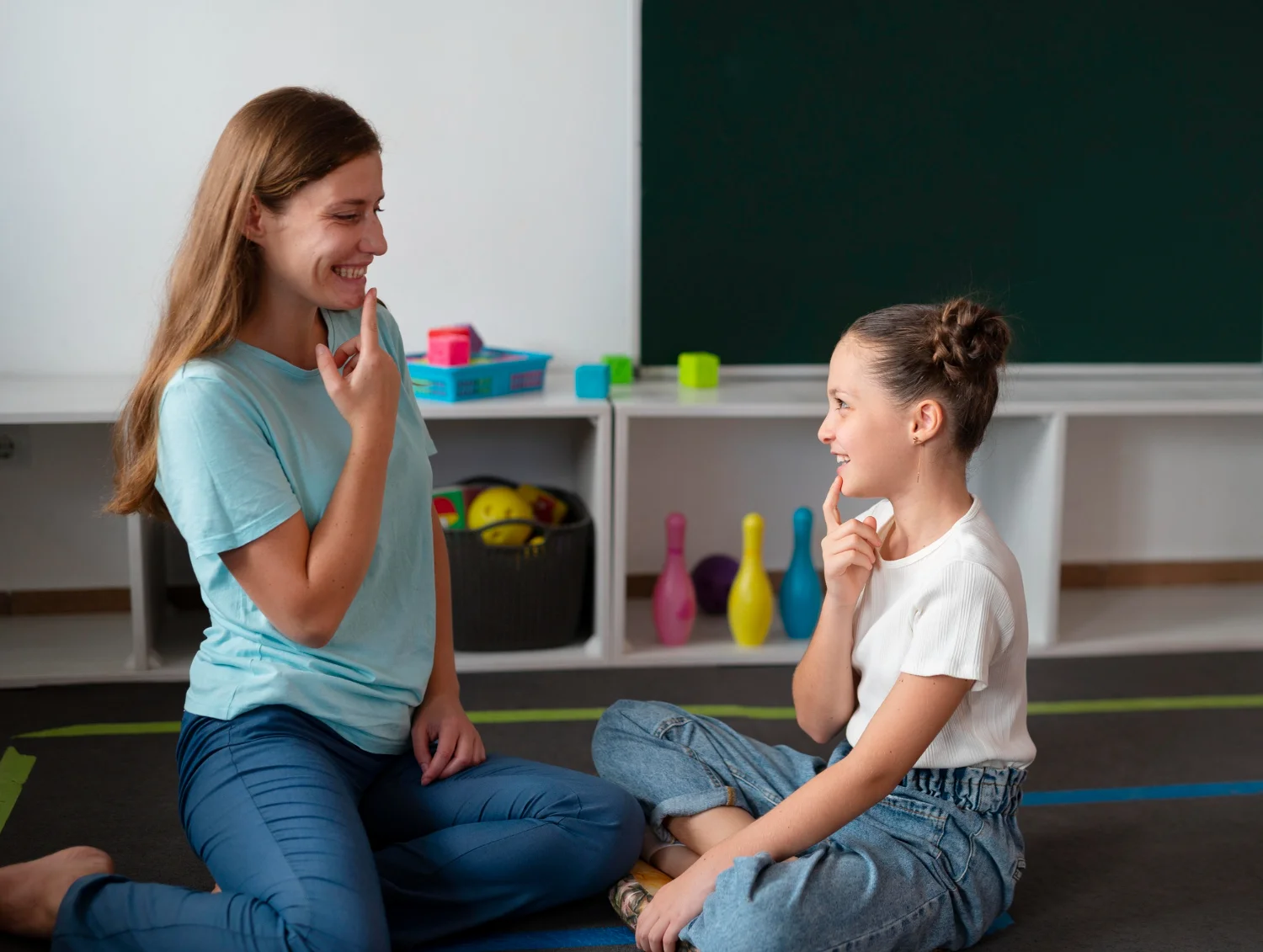 A child enjoying a speech therapy session in a fun and engaging environment