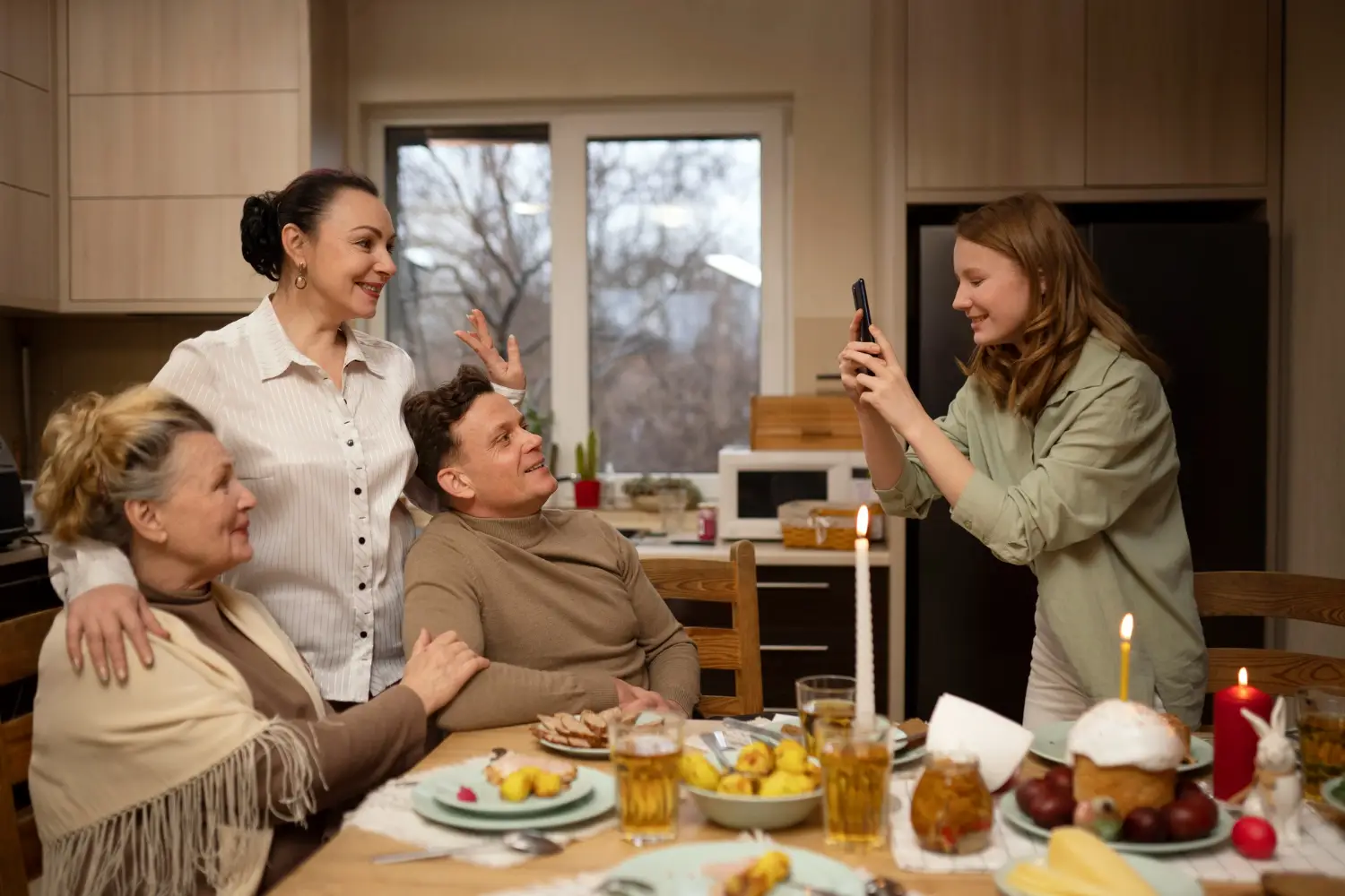 Happy family engaging in home activities with support from a professional caregiver.
