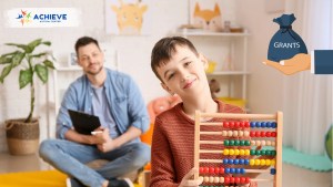 father researching Autism Grants for Families 2025-26 online